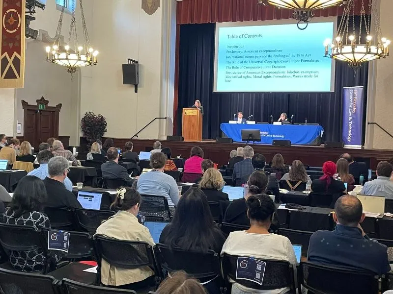 Prof. Jane Ginsburg addresses a large audience.