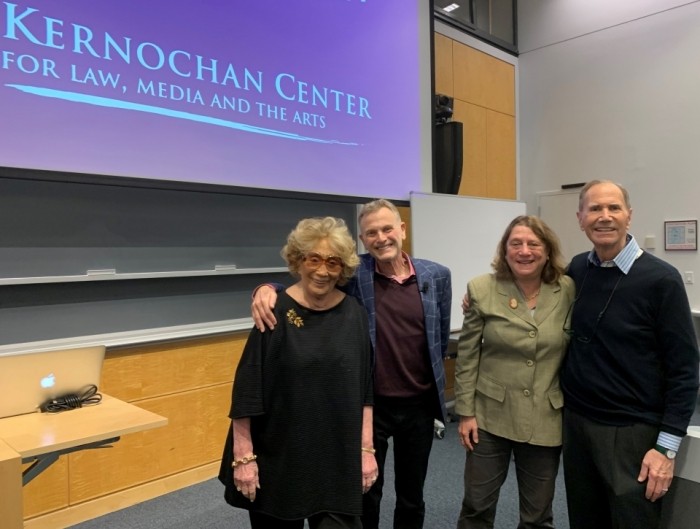 Myna Gershon (wife of Freddie), Jonathan Wolff, Prof. Jane Ginsburg, and Freddie Gershon, '64 Myna Gershon (wife of Freddie), Jonathan Wolff, Prof. Jane Ginsburg, and Freddie Gershon are posing for a picture inside of classroom